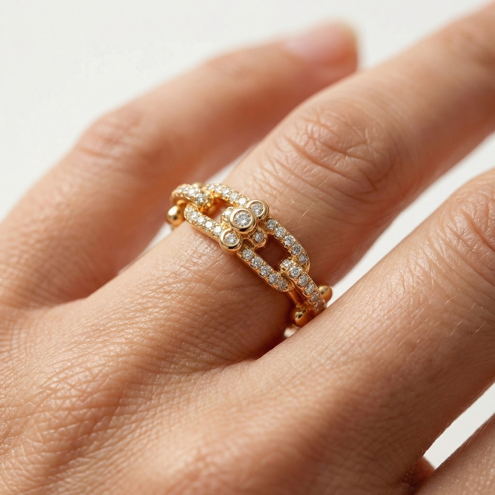 Interlock Pave Ring with White Round Stone – on Yellow Gold